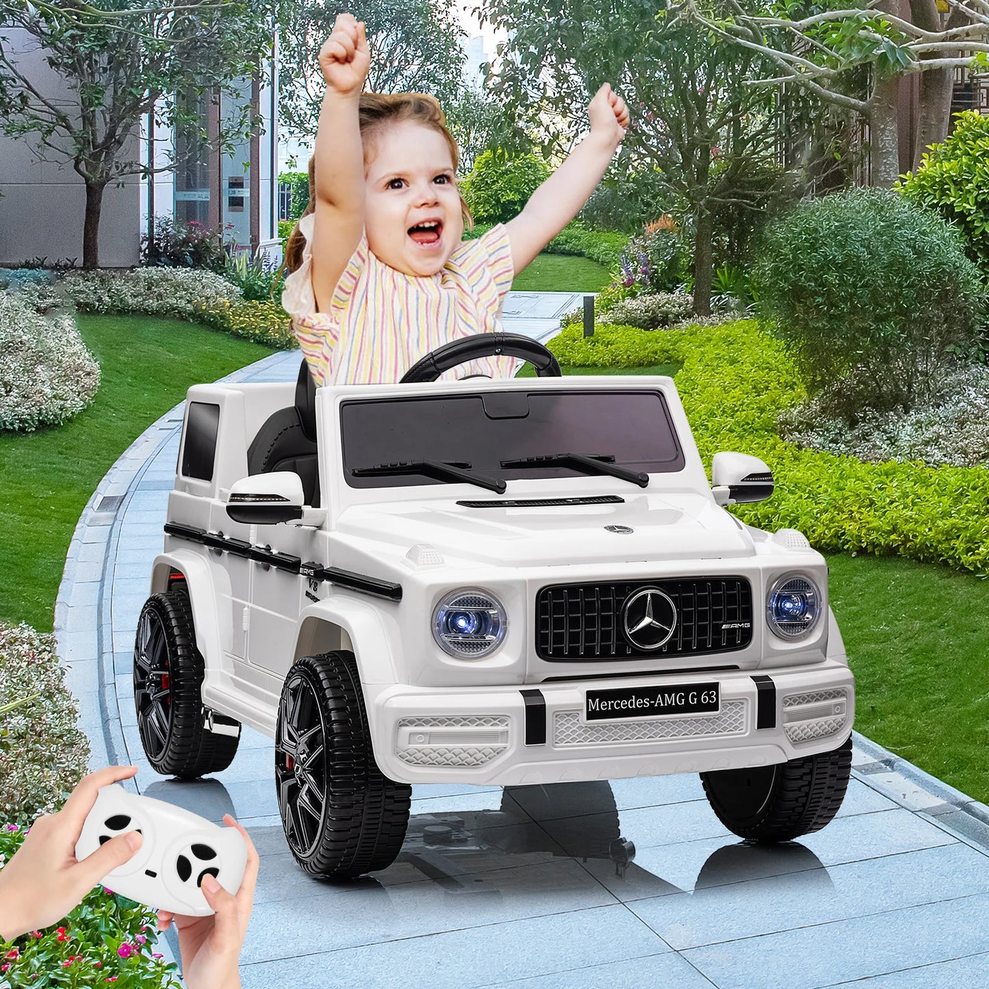 Child playing with a toy Mercedes-Benz car on a patio